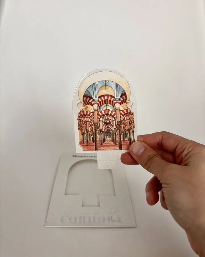 Sacando la figura troquelada de la postal